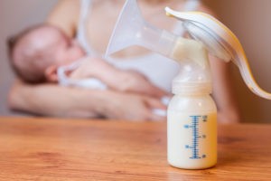 Breastfeeding mother and lactation pump